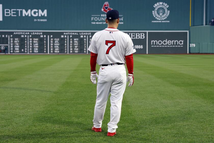 Boston Red Sox's Masataka Yoshida stands on the field during warmups before a baseball game against the Chicago Cubs, Sunday, April 28, 2024, in Boston. (AP Photo/Michael Dwyer)
