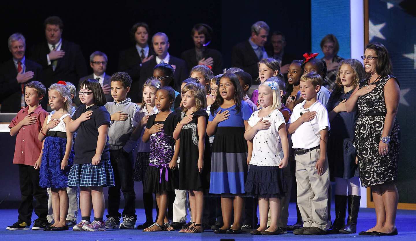 Third-graders from W.R. O'Dell Elementary School in Concord, N.C., lead the Pledge of Allegiance during opening night ceremonies at the Democratic National Convention in Charlotte.