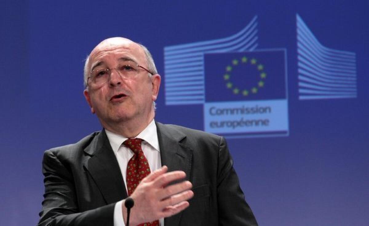 Joaquin Almunia, the European commissioner for competition, speaks at a news conference in Brussels after the European Commission fined Microsoft for non-compliance with browser choice commitments.