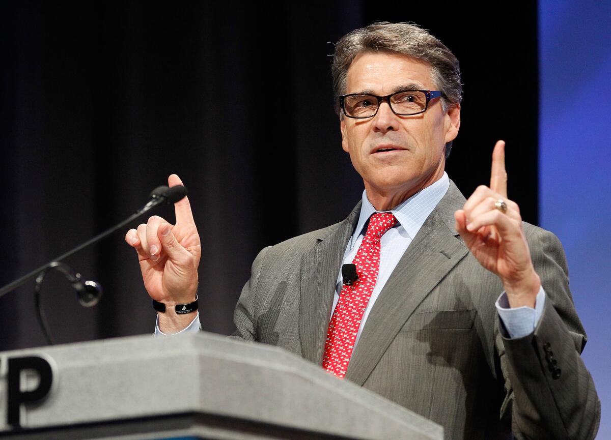 Texas Gov. Rick Perry was among the speakers Friday at a gathering in Dallas sponsored by Americans for Prosperity, a group affiliated with GOP donors Charles and David Koch.