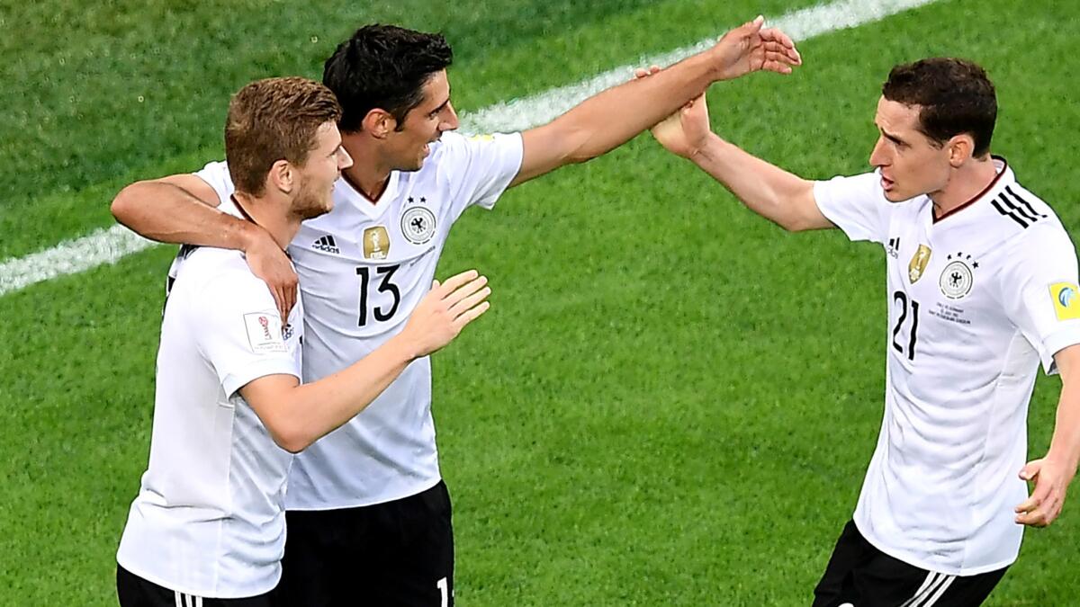 Germany midfielder Lars Stindl, center, is congratulated by teammates Timo Werner, left, and Sebastian Rudy after scoring against Chile in the first half of the Confederations Cup final on Sunday.