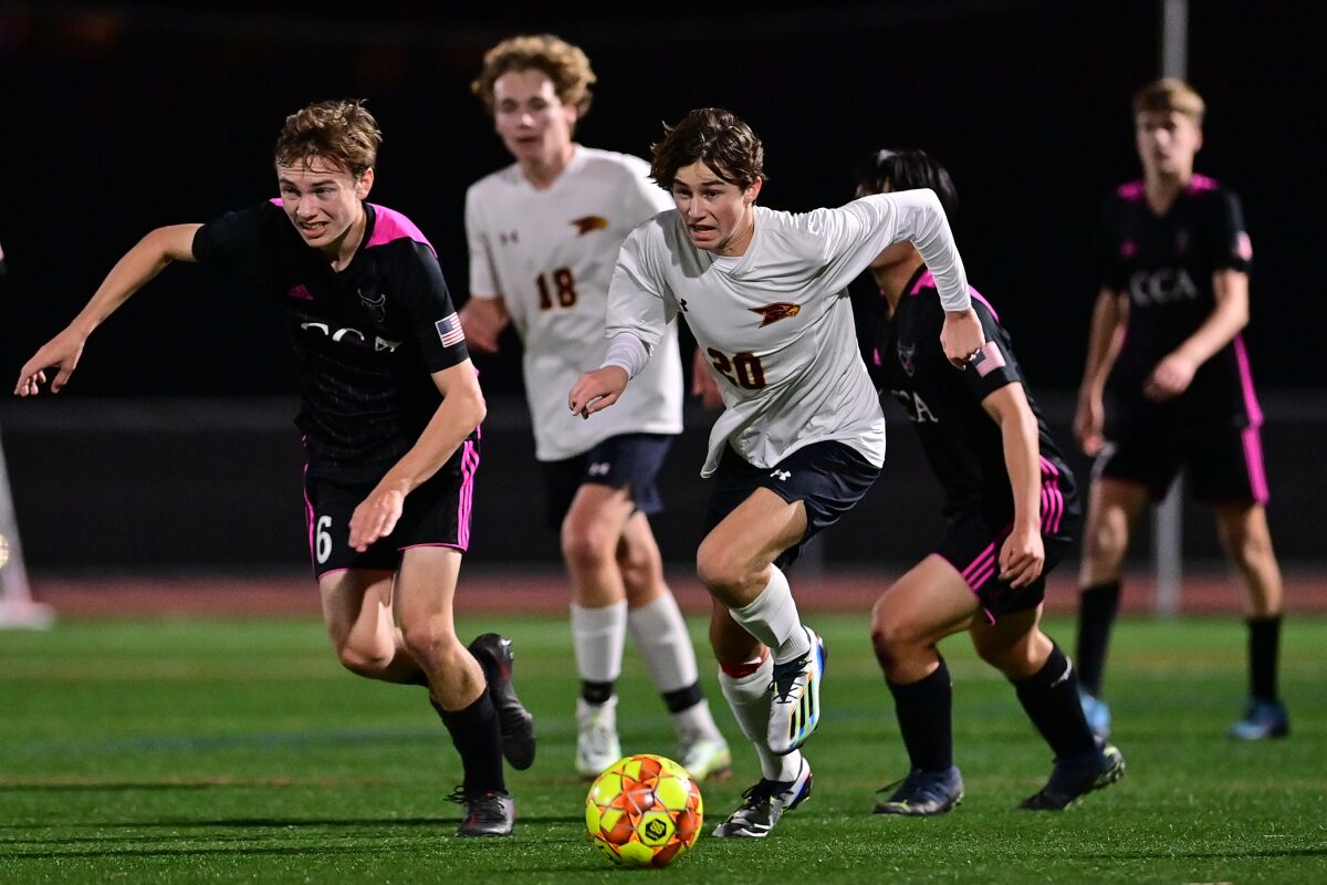 The Falcons' Maksim Makar looks to control the ball.