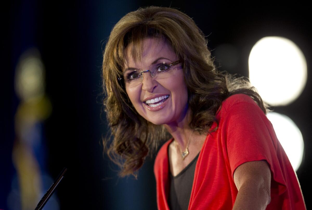 Fox News commentator Sarah Palin, shown in June 2013, says President Obama's "mom jeans" signal weakness to Russian President Vladimir Putin.