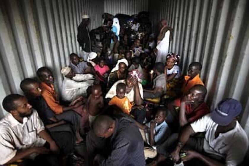 Muslim refugees fill the back of a semi-trailer bound for Cameroon as they flee the violence in the Central African Republic.