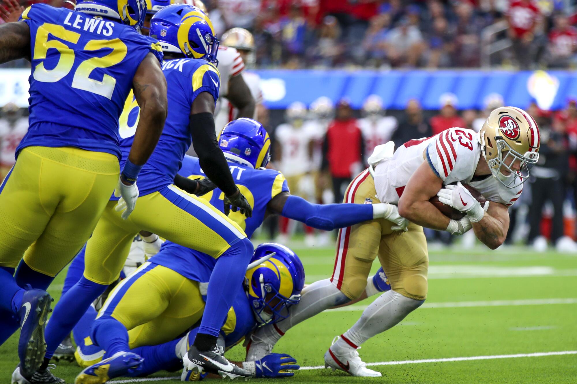 San Francisco 49ers running back Christian McCaffrey breaks away from the Rams defense in the fourth quarter.