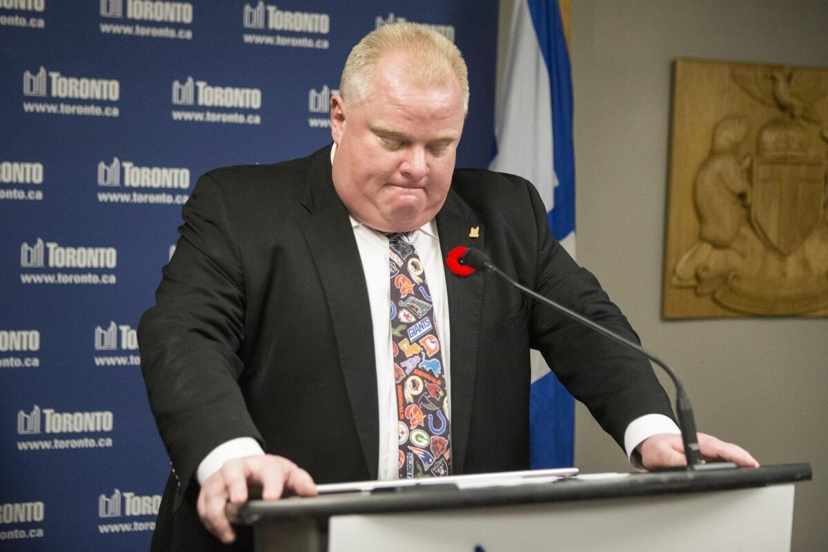 Toronto Mayor Rob Ford, wearing a loud NFL tie, admits Tuesday at a City Hall news conference to smoking crack cocaine. He says he will not step down.