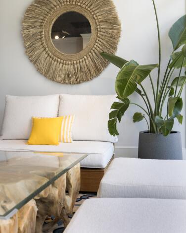 A large selection of outdoor furniture and decor are seen at Willow Creek Designs, including a carved tree root table at the store in Studio City, Calif., on May 14, 2025. (Alisha Jucevic/For The Times)