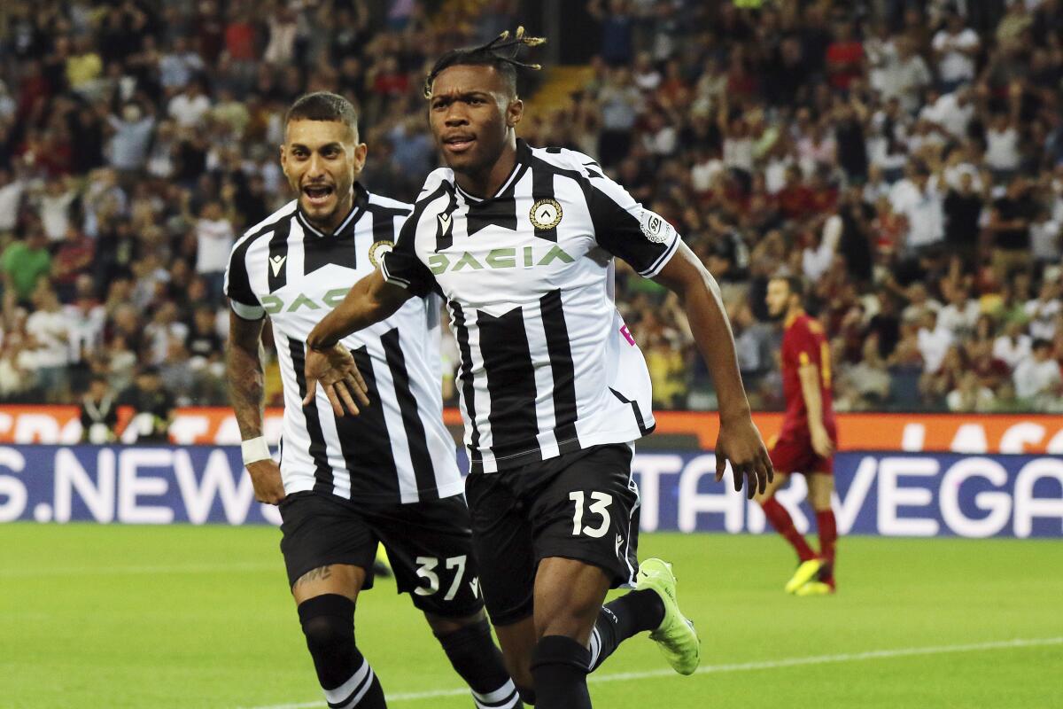 Udinese's Destiny Udogie celebrates after scoring to 1-0 during the Italian Serie A soccer match between Udinese and Roma, at Friuli stadium in Udine, Italy, Sunday Sept. 4, 2022. (Andrea Bressanutti/LaPresse via AP)