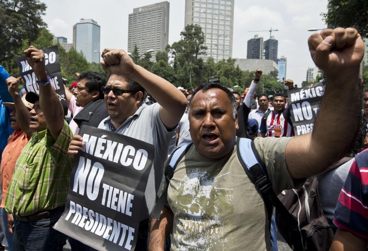 Teachers protest and block highways to protest e education reform legislation, in Mexico City on Wednesday.