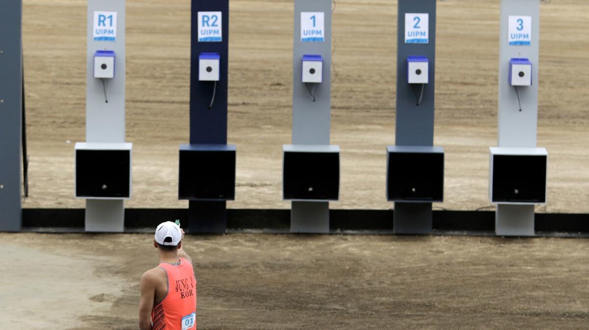 Jinhwa Jung of South Korea, takes aim during the run-shoot event at the Modern Pentathlon World Cup in Pomona. The modern pentathlon comprises five events -- swimming, fencing, cross-country running, shooting and show jumping.