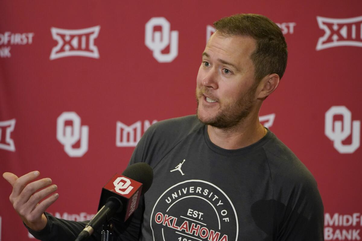 Oklahoma coach Lincoln Riley answers questions during a news conference 