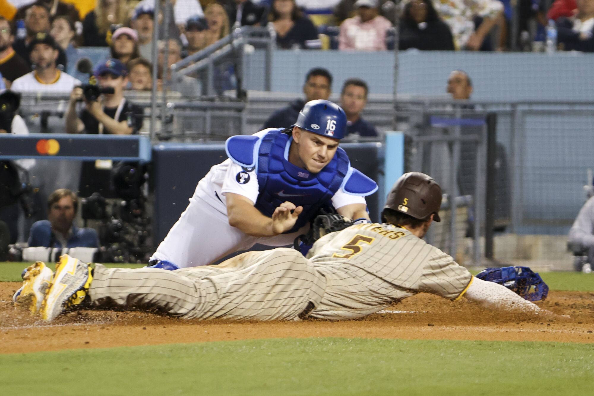  Dodgers catcher Will Smith tags out  Padres' Wil Myers at home plate during the sixth inning.