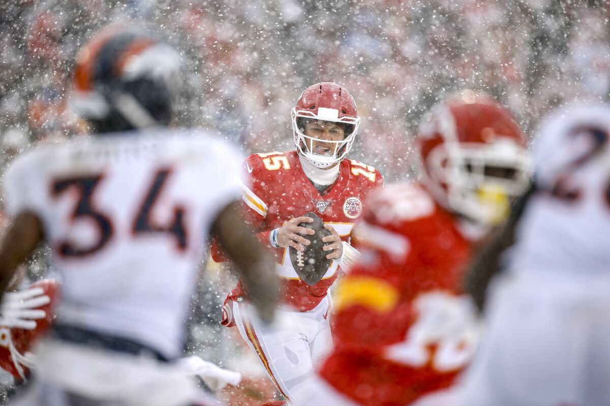 Kansas City Chiefs quarterback Patrick Mahomes looks to pass during the third quarter against the Denver Broncos.
