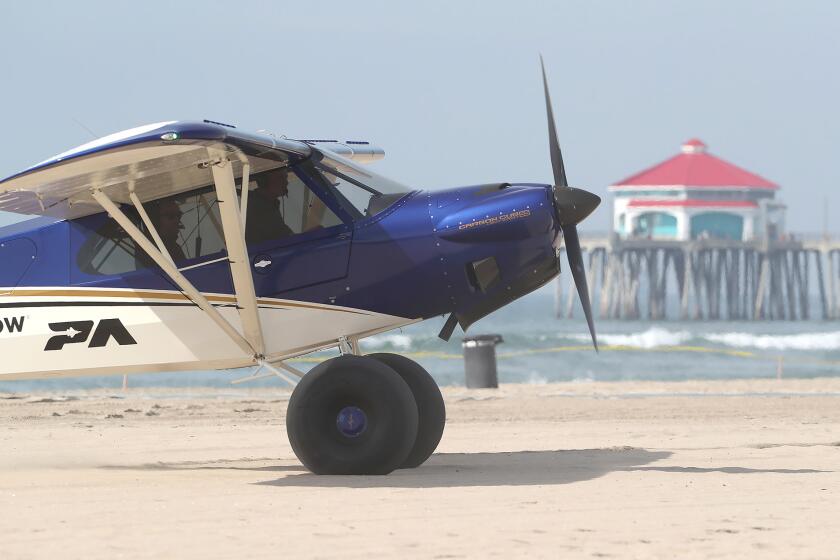 A Short Landing and Take-off aircraft better known as a STOL plane, makes a landing on the sand during the Pacific Airshow press conference on the beach at the end of Huntington St. in Huntington Beach on Thursday. The STOL is popular with Alaska bush pilots because of their ability to land on short runways or water with minimal effort. The planes will be featured in the 2024 Pacific Air Show. This year, the Pacific Airshow will build a temporary runway on the sand for touch and go landings to entertain the crowd.