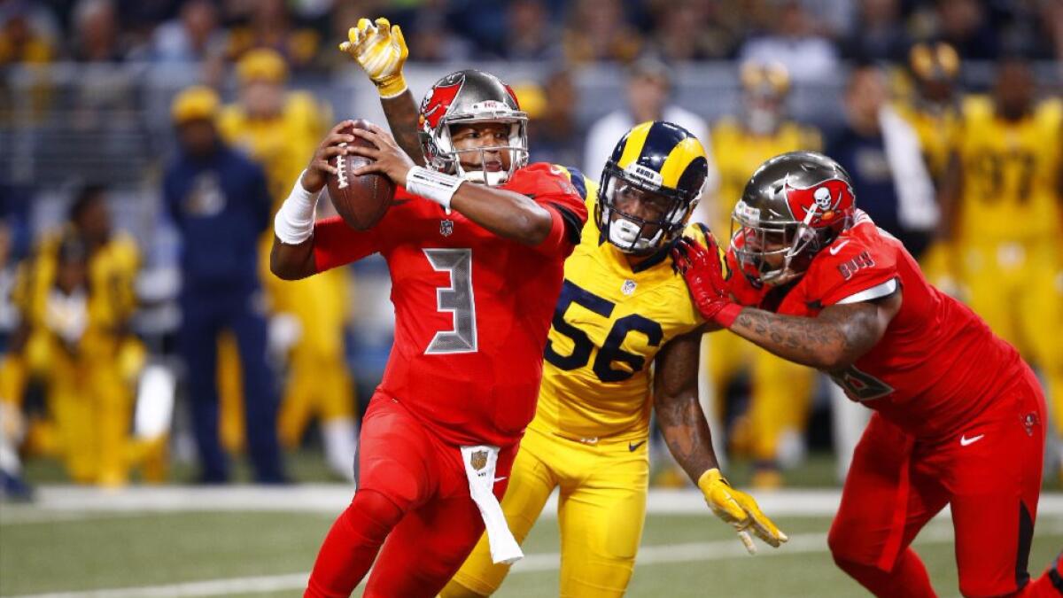 Rams linebacker Akeem Ayers (56) chases Buccaneers quarterback Jameis Winston during a game on Dec. 17.