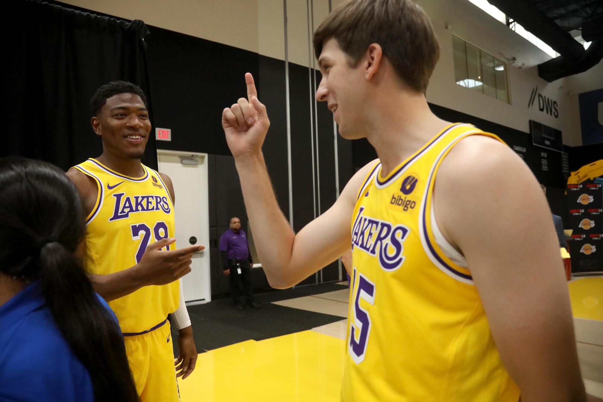 Lakers forward Rui Hachimura, left, and Austin Reaves enjoy a light moment during media day.