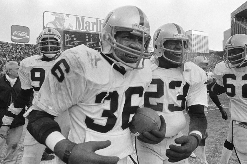 FILE - In this Sunday, Jan. 5, 1981 file photo, Oakland Raiders safety Mike Davis (36) runs off the field.