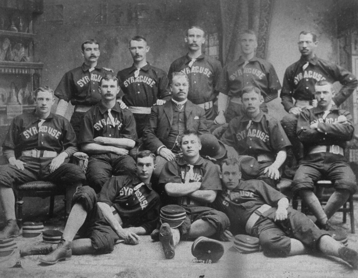 The Syracuse Stars Base Ball Club poses for a team portrait in 1889. Black baseball pioneer Moses Fleetwood Walker is in the back row, far right.