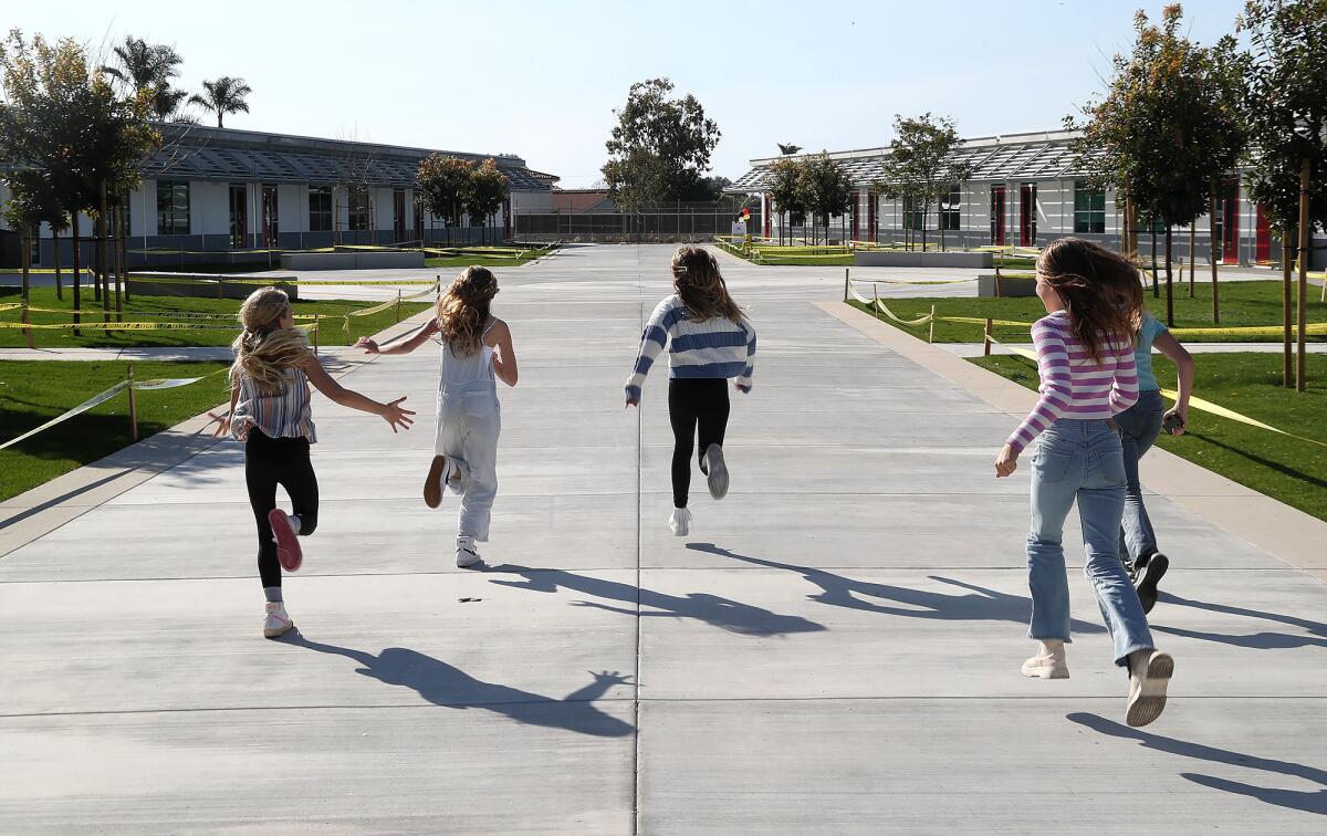 Sowers Middle School students open the new campus with an unofficial sprint down the school's central path "runway."