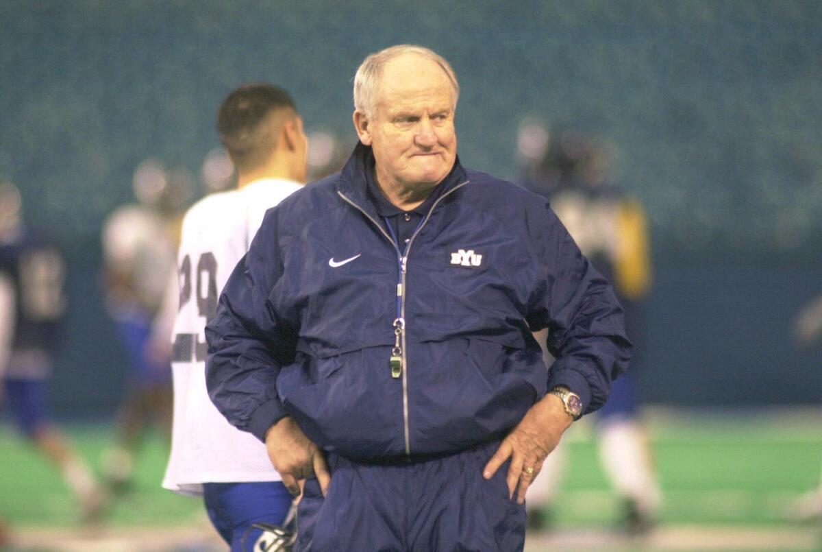 LaVell Edwards watches the BYU football team practice on Dec. 24, 1999.