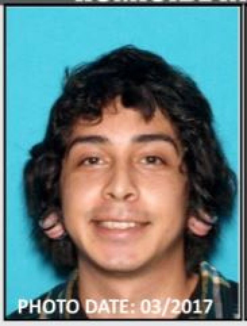 Suspect Victor Sosa slightly grinning.