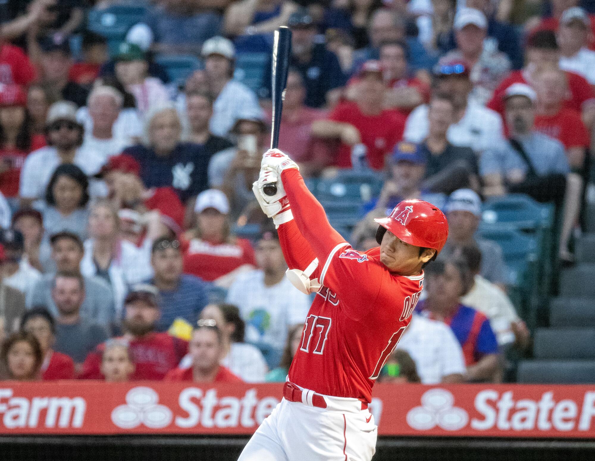 Shohei Ohtani hits an RBI triple for the Angels against the New York Yankees at Angel Stadium on July 18.