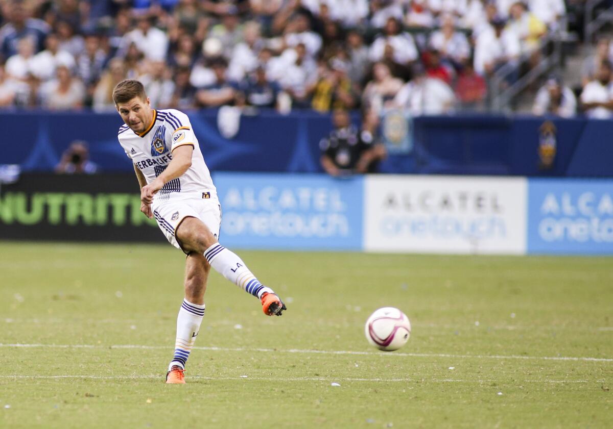 Galaxy midfielder Steven Gerrard sends the ball forward during a game against the Portland Timbers on Oct. 18.