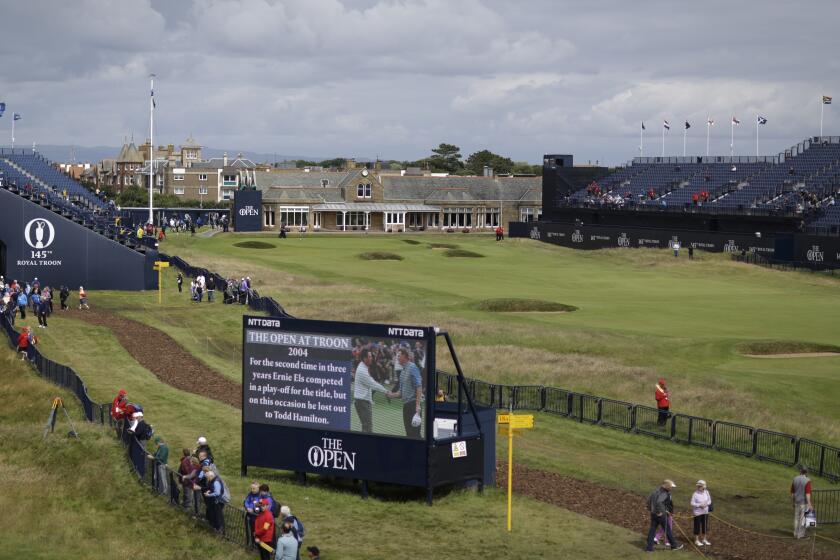 FILE - A general view of the 18th green and the clubhouse at the Royal Troon Golf Club in Troon, Scotland, Tuesday, July 12, 2016, ahead of the British Open Golf Championships. Royal Troon will feature the longest hole in British Open history when the Ayrshire links host the event for the 10th time in July, 2024. The par-five sixth hole will be extended to 623 yards, which is 22 yards longer than in 2016 the last time Troon hosted. (AP Photo/Matt Dunham, File)