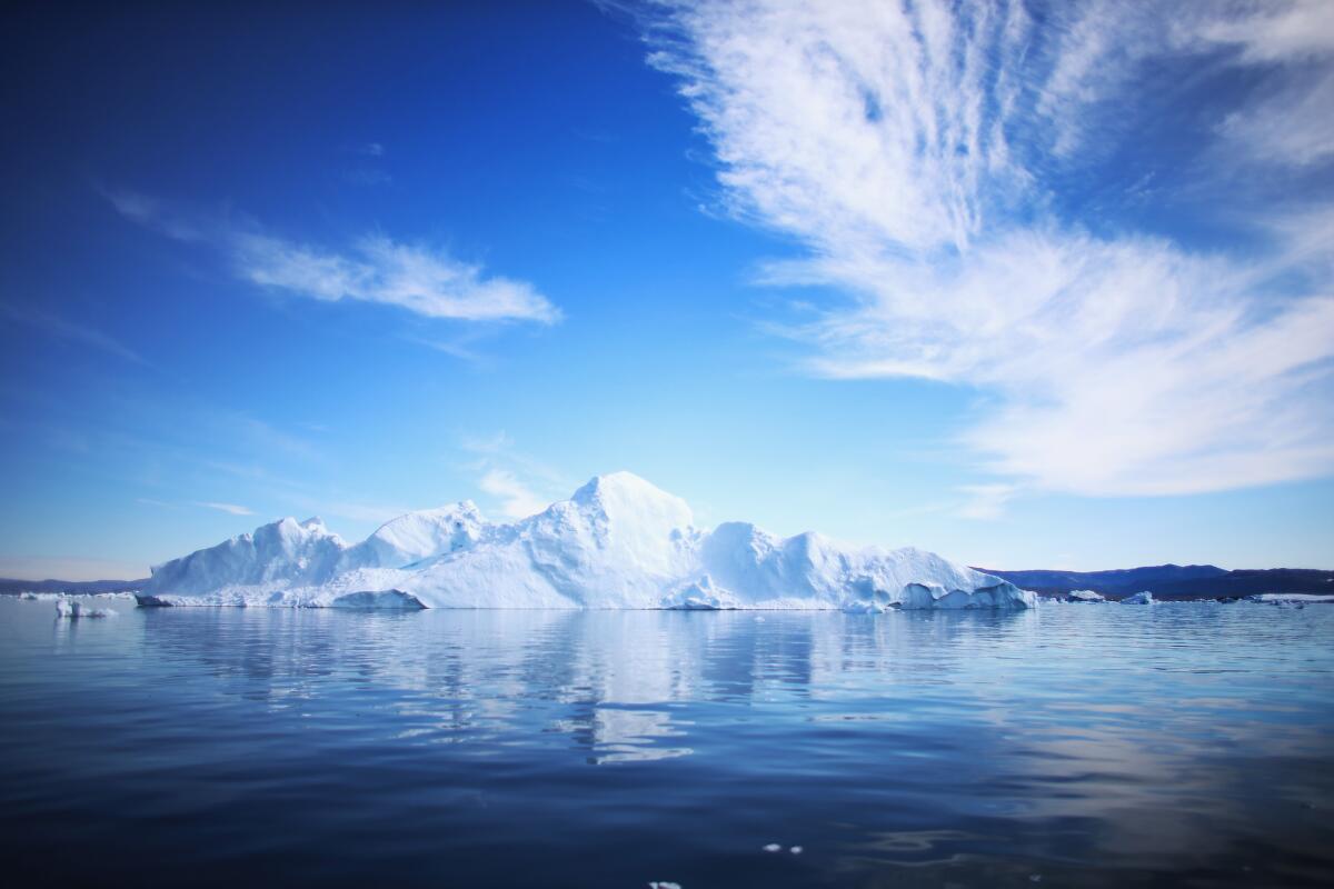 An iceberg floats on the water last summer in Ilulissat, Greenland. In September, a panel of climate experts said it was 95% certain that human activity is driving global warming.