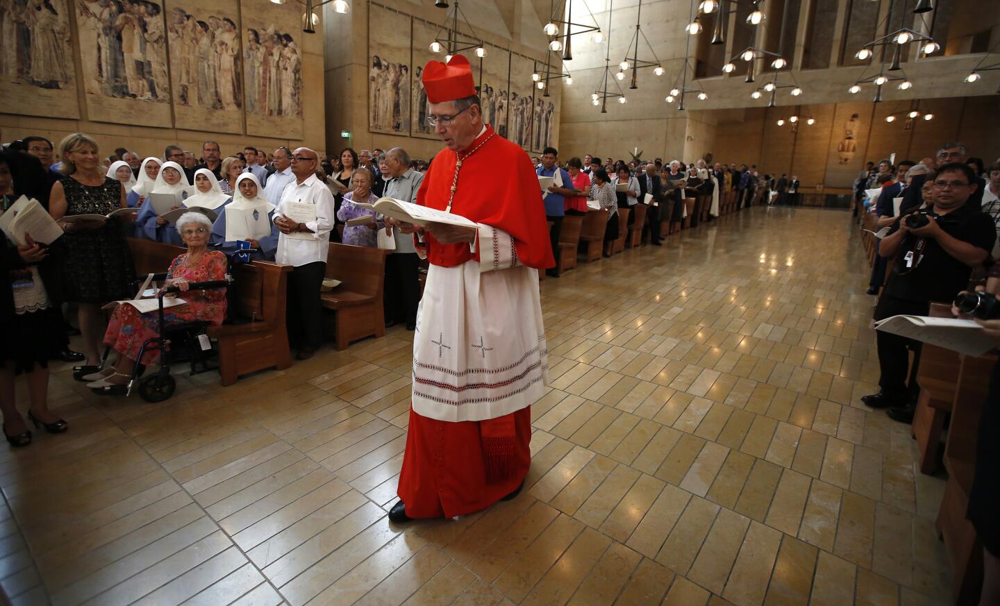 Cardinal Roger Mahony arrives for ordination of auxiliary bishops at the Cathedral of Our Lady of the Angels in Los Angeles.