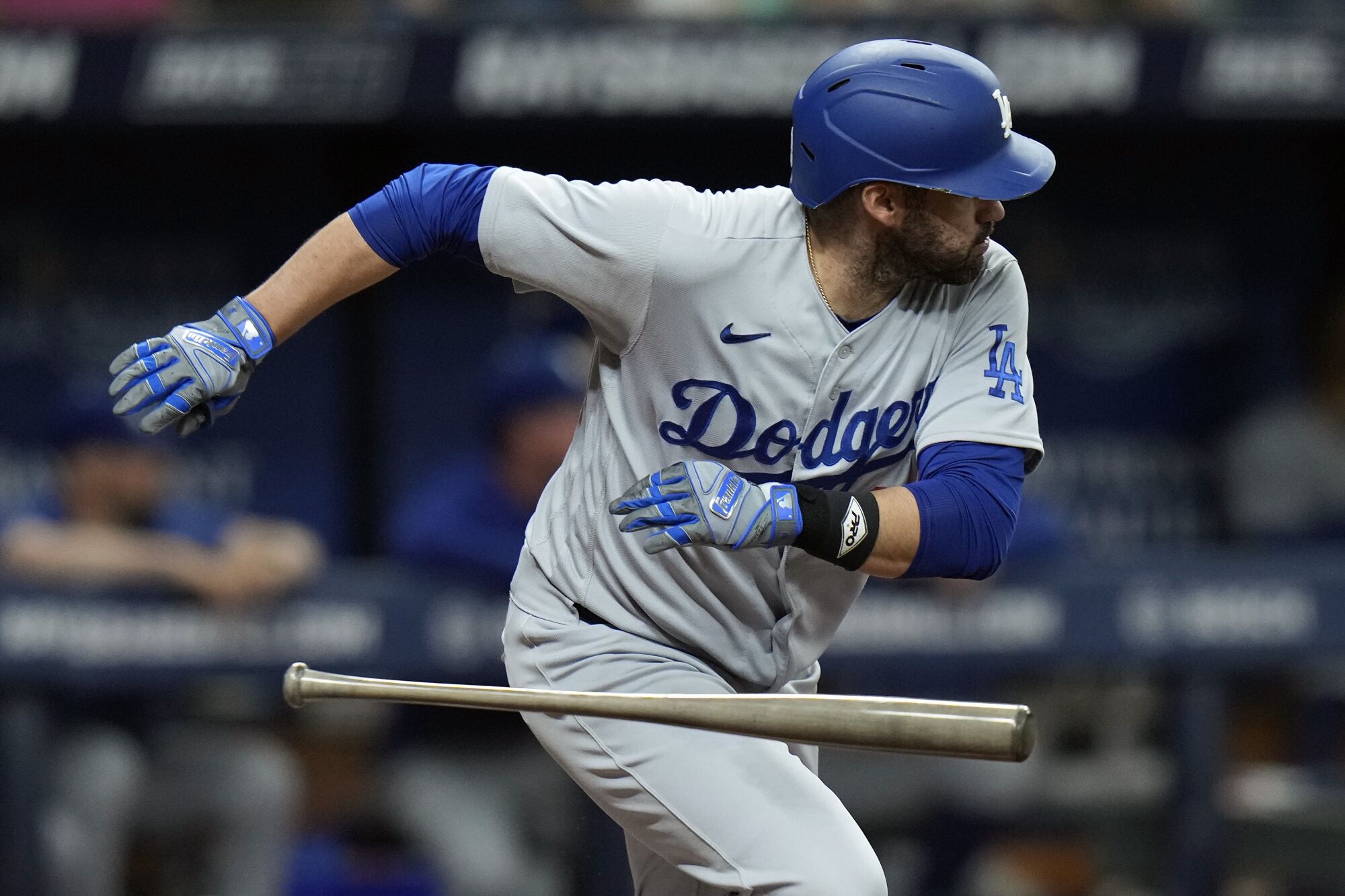 Dodgers' J.D. Martinez drops his bat after an RBI single against the Tampa Bay Rays on May 26 , 2023, in St. Petersburg, Fla.