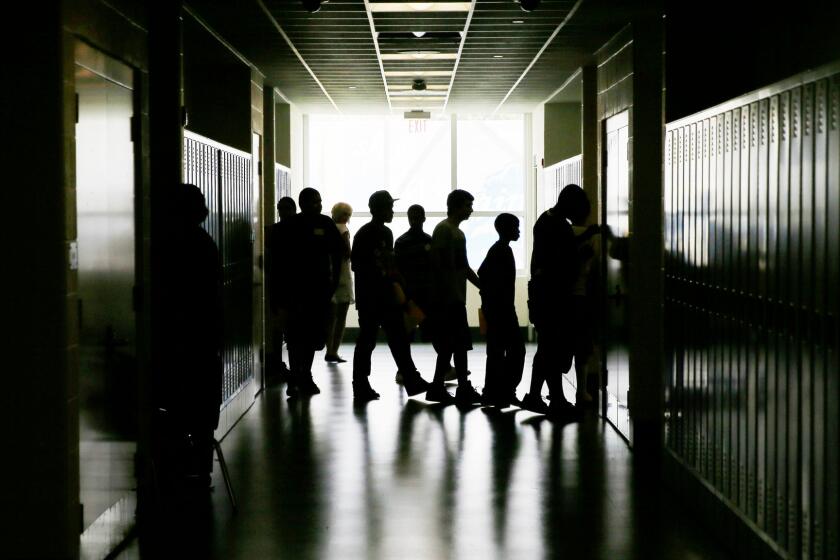 Students walk through the halls of a high school in Philadelphia in 2013.