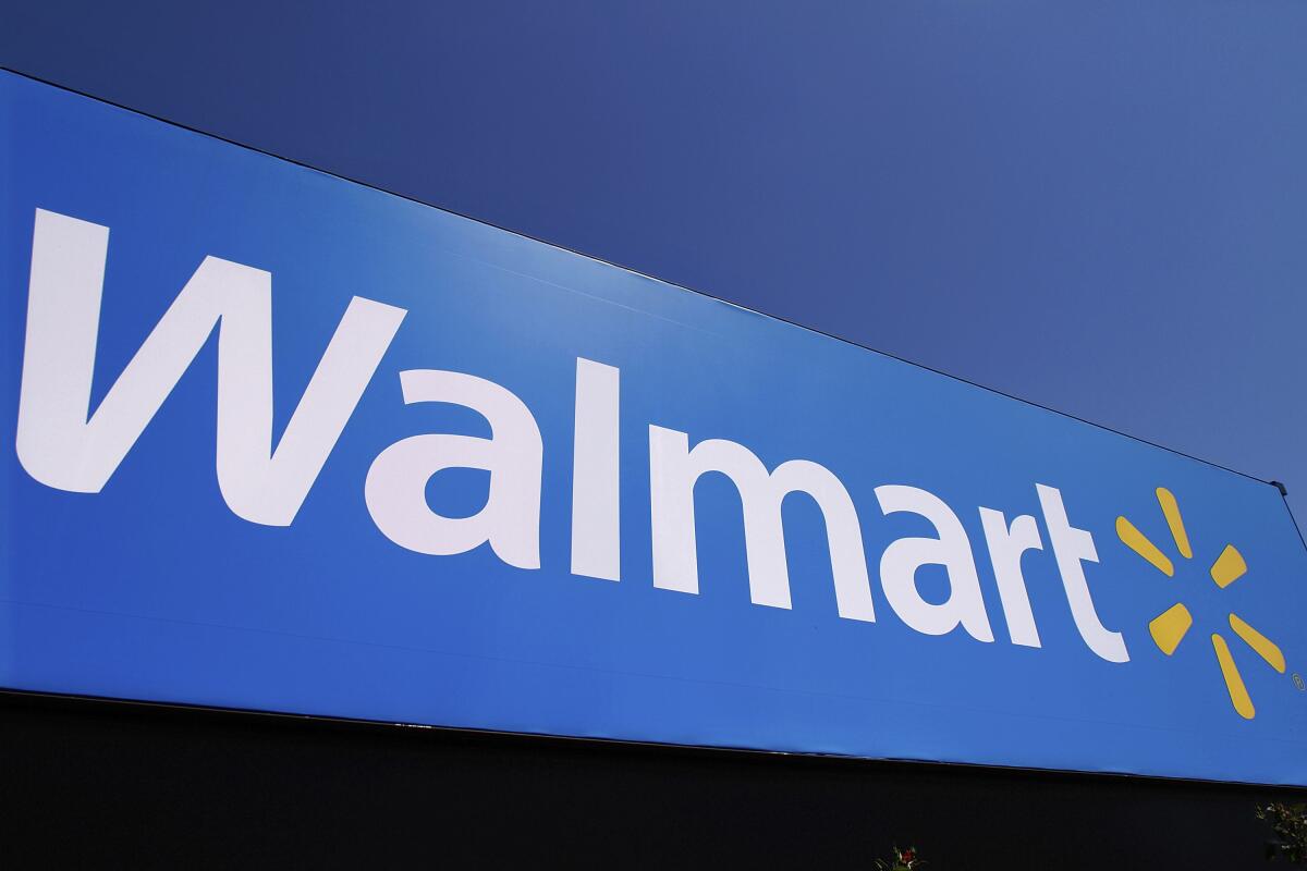 FILE - The Walmart logo is displayed on a store in Springfield, Ill., May 16, 2011. Walmart Inc. said Monday, Aug. 15, 2022, that it has signed a deal with Paramount Global to offer the entertainment company's streaming service as a perk to subscribers of the discounter's shipping subscription service. (AP Photo/Seth Perlman, File)