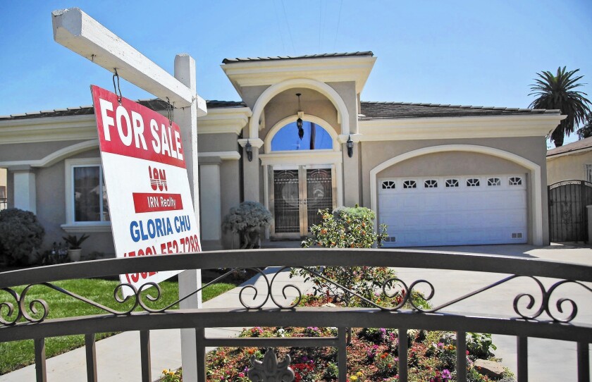 Rigid home loan standards come as a reaction to the mortgage credit debacle that triggered a global financial crisis. Above, a home for sale in Monterey Park in 2014.