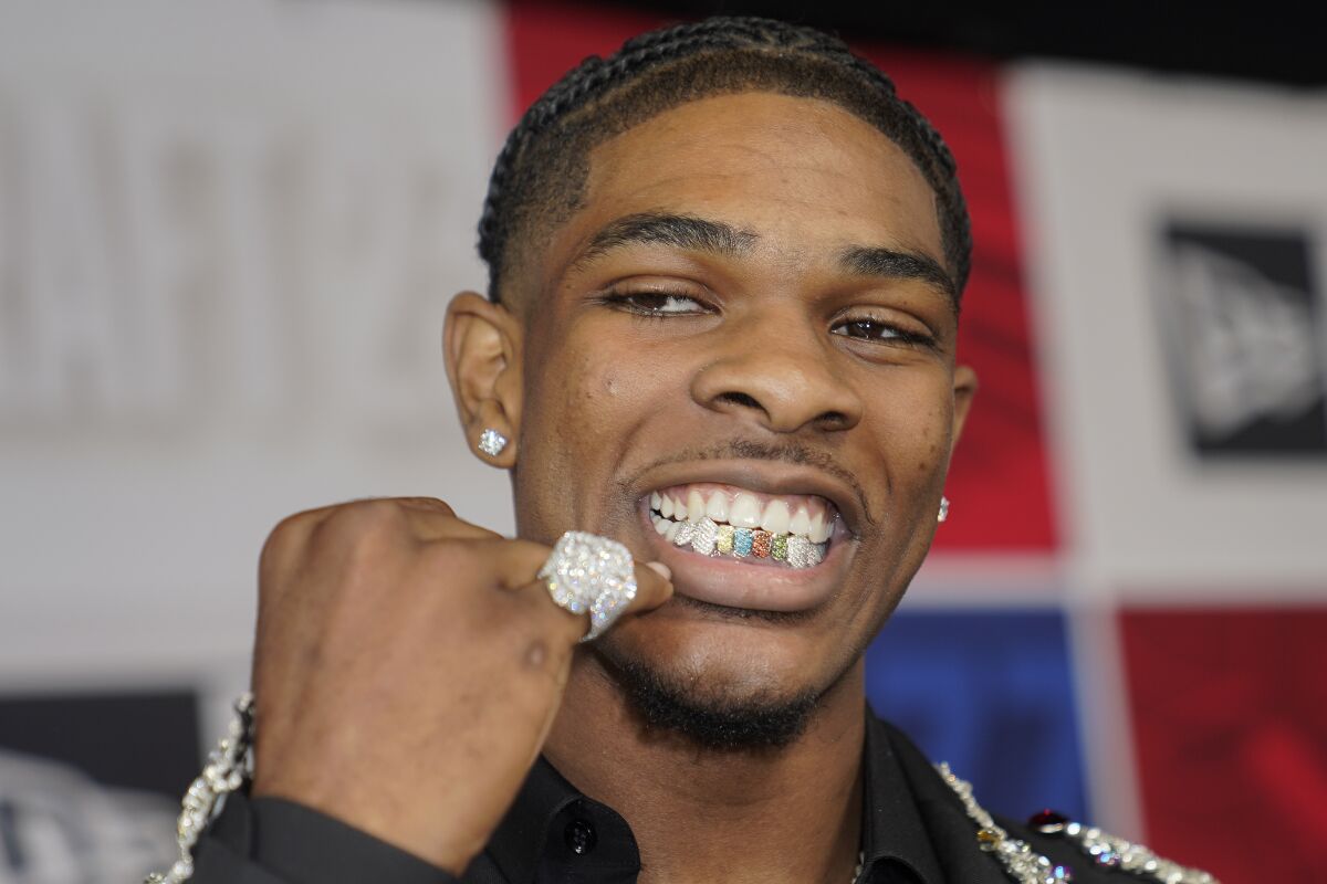 Scoot Henderson shows off his family-inspired grill before the NBA draft.