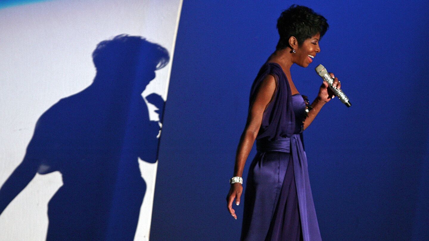 Natalie Cole makes her entrance to perform at the Hollywood Bowl in September 2009; the concert had been delayed while she went through a liver transplant in July.