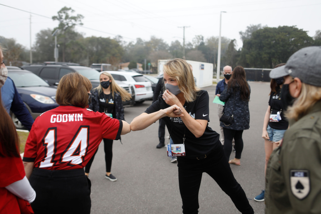 Jane Skinner, Roger Goodell's wife, elbow bumps Rep. Kathy Castor (D-Fla.) during a charity event in Tampa in February.