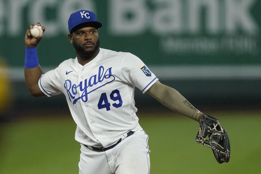 Kansas City Royals second baseman Hanser Alberto throws during the ninth inning of a baseball game against the Milwaukee Brewers Wednesday, May 19, 2021, in Kansas City, Mo. The Royals won 6-4. (AP Photo/Charlie Riedel)