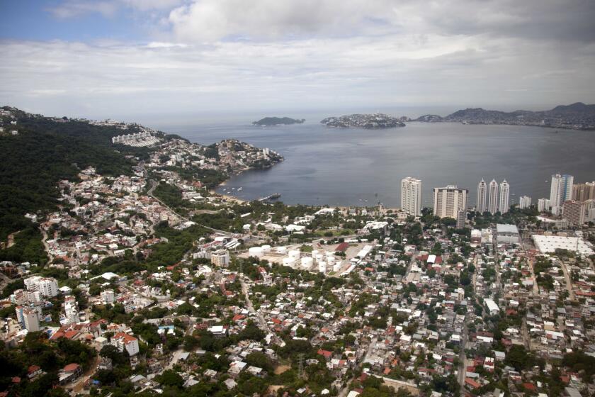 FILE - This Sept. 20, 2013 file photo shows an aerial view of the Pacific resort city of Acapulco, Mexico. The Mexican coastal city pulled a pair of controversial video ads Thursday, Aug. 6, 2020, touting the faded resort’s reputation as an “anything goes” tourism destination because they weren't appropriate during the new coronavirus pandemic. (AP Photo/Eduardo Verdugo, File)