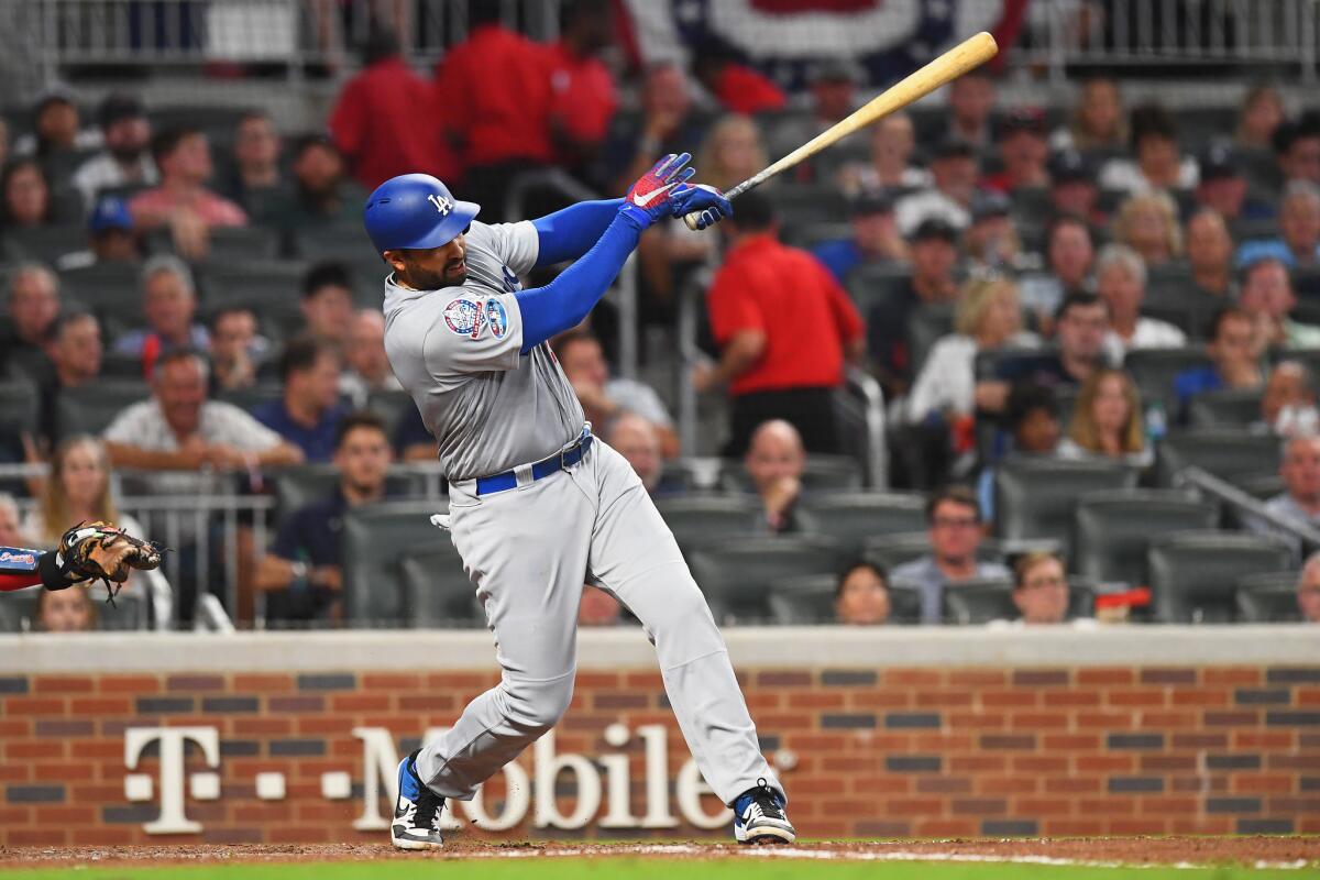 Matt Kemp #27 of the Los Angeles Dodgers hits a double in the sixth inning against the Atlanta Braves during Game Three of the National League Division Series at SunTrust Park on October 7, 2018 in Atlanta, Georgia.