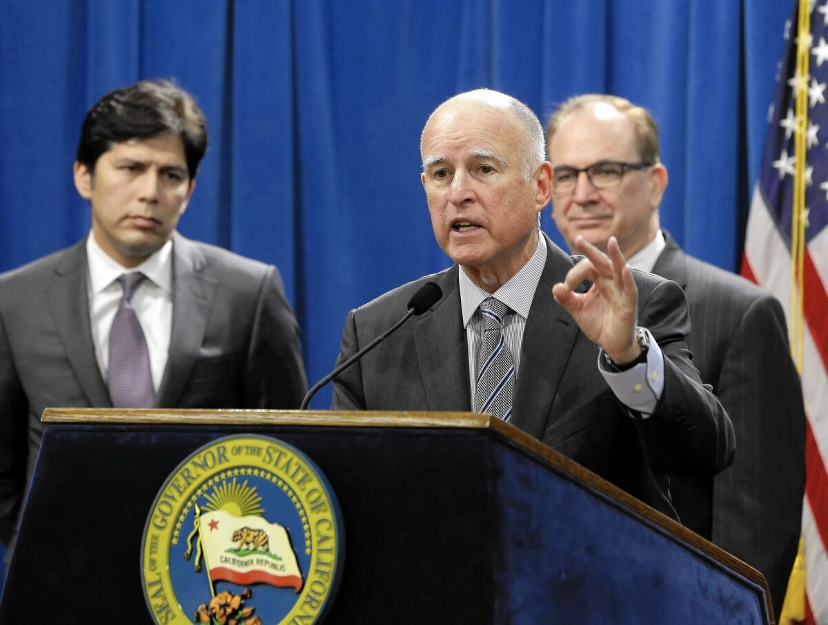 Gov. Jerry Brown answers questions concerning the proposed $1-billion package of emergency drought-relief legislation Thursday in the Capitol.