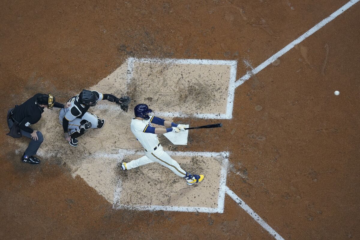 Milwaukee Brewers' Christian Yelich hits a grand slam during the fourth inning of a baseball game against the Pittsburgh Pirates Monday, April 18, 2022, in Milwaukee. (AP Photo/Morry Gash)