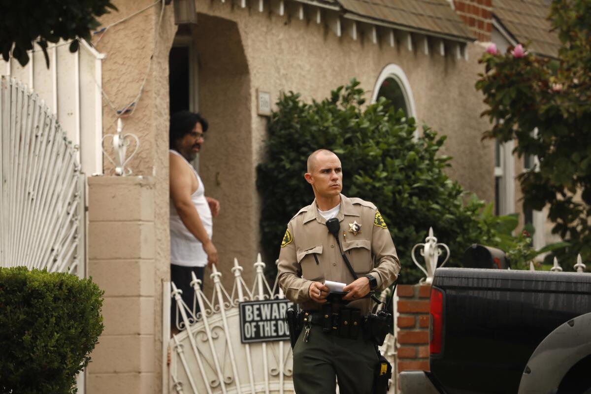 A deputy works near the site of a Compton shooting that ended in one man's death.