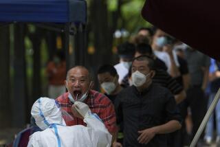 Residents line up to get a throat swab at a testing site due to requirements for a negative COVID test in the last 72 hours to enter some buildings and using public transportation in Beijing, Tuesday, June 28, 2022. (AP Photo/Andy Wong)