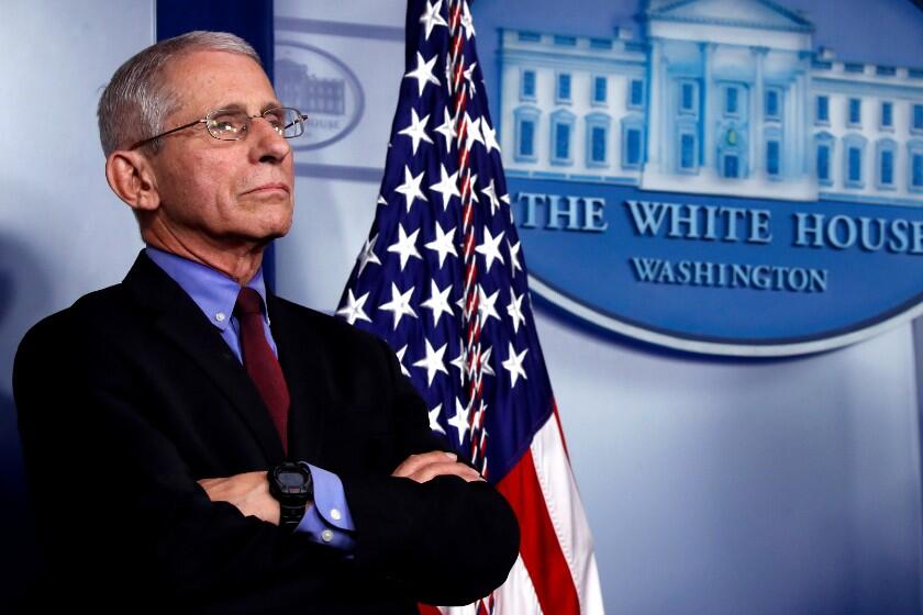 Dr. Anthony Fauci, director of the National Institute of Allergy and Infectious Diseases, listens during a briefing about the coronavirus in the James Brady Press Briefing Room, Friday, March 27, 2020, in Washington. (AP Photo/Alex Brandon)