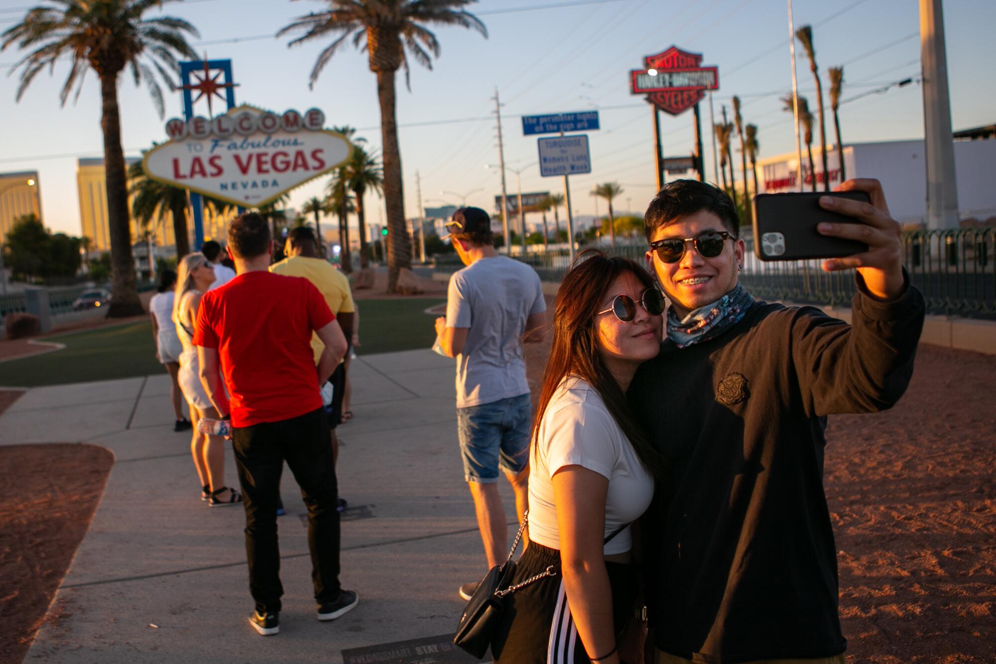 People stop to take photos at the iconic Welcome to Las Vegas sign 