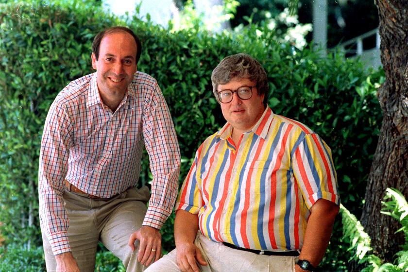 Gene Siskel poses with Roger Ebert in Los Angeles in 1986.