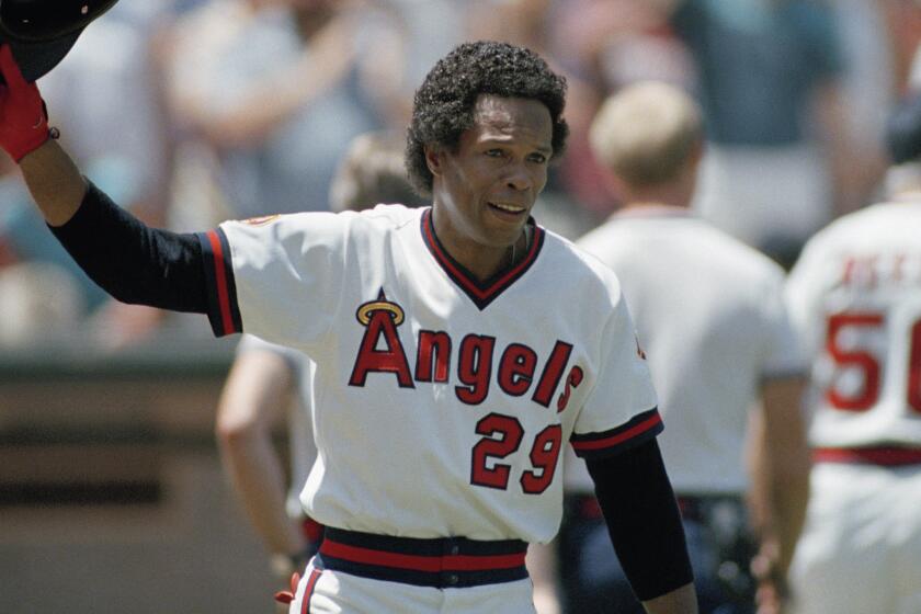 Rod Carew acknowledges the fans after his 3,000th career hit.