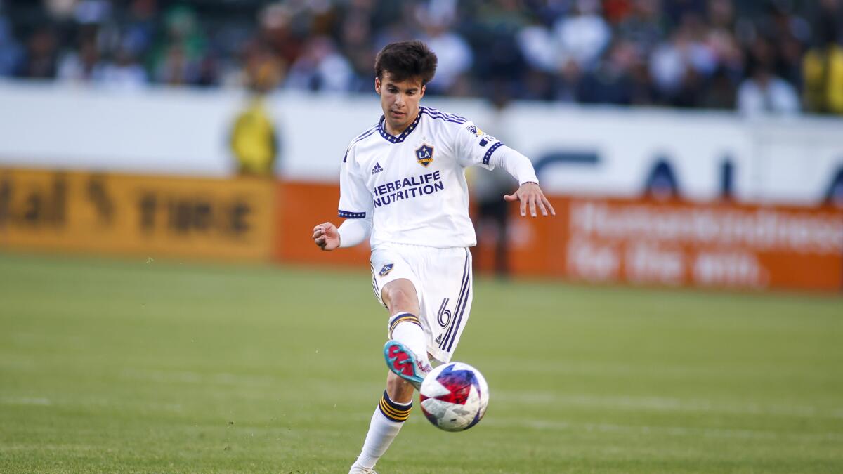 Galaxy midfielder Riqui Puig passes the ball against the Seattle Sounders.