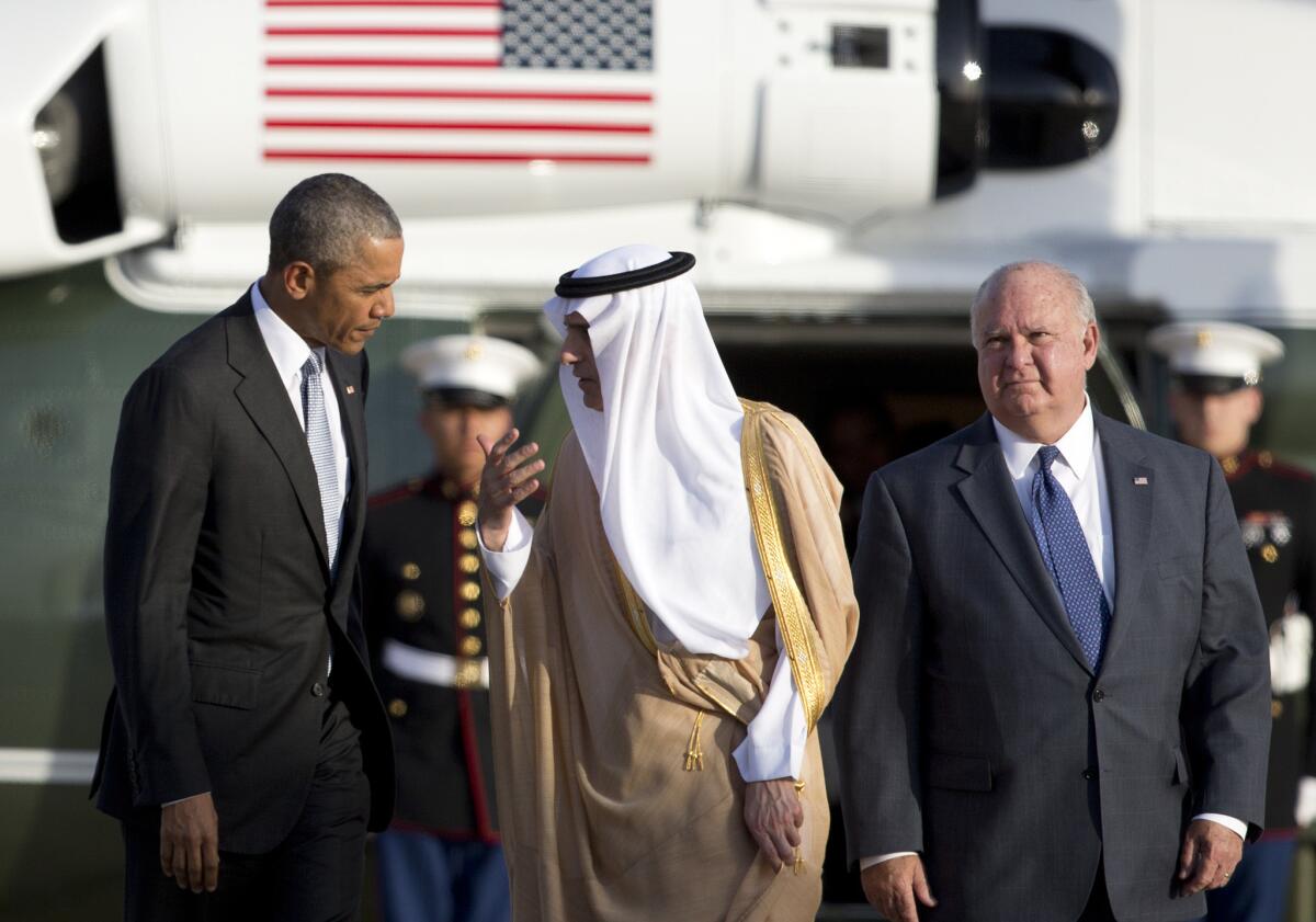 Before boarding Air Force One for the trip to from Riyadh to London, President Barack Obama talks with Saudi Foreign Minister Adel al-Jubeir as U.S. Ambassador to Saudi Arabia Joseph W. Westphal stands nearby.